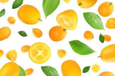 Image of Fresh ripe kumquat fruits falling on white background