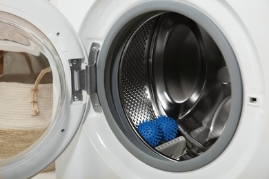 Photo of Blue dryer balls in washing machine drum