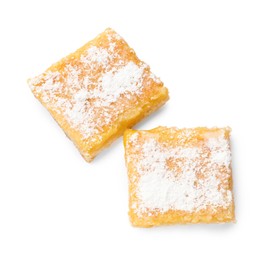 Photo of Tasty lemon bars with powdered sugar isolated on white, top view