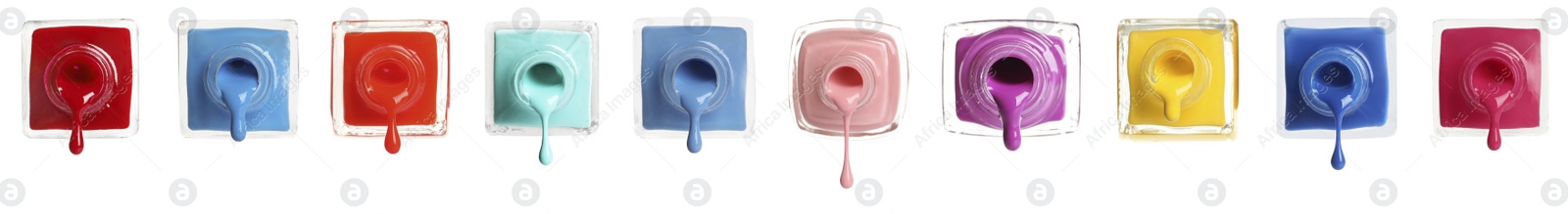 Image of Set of different nail polishes dripping on white background. Banner design