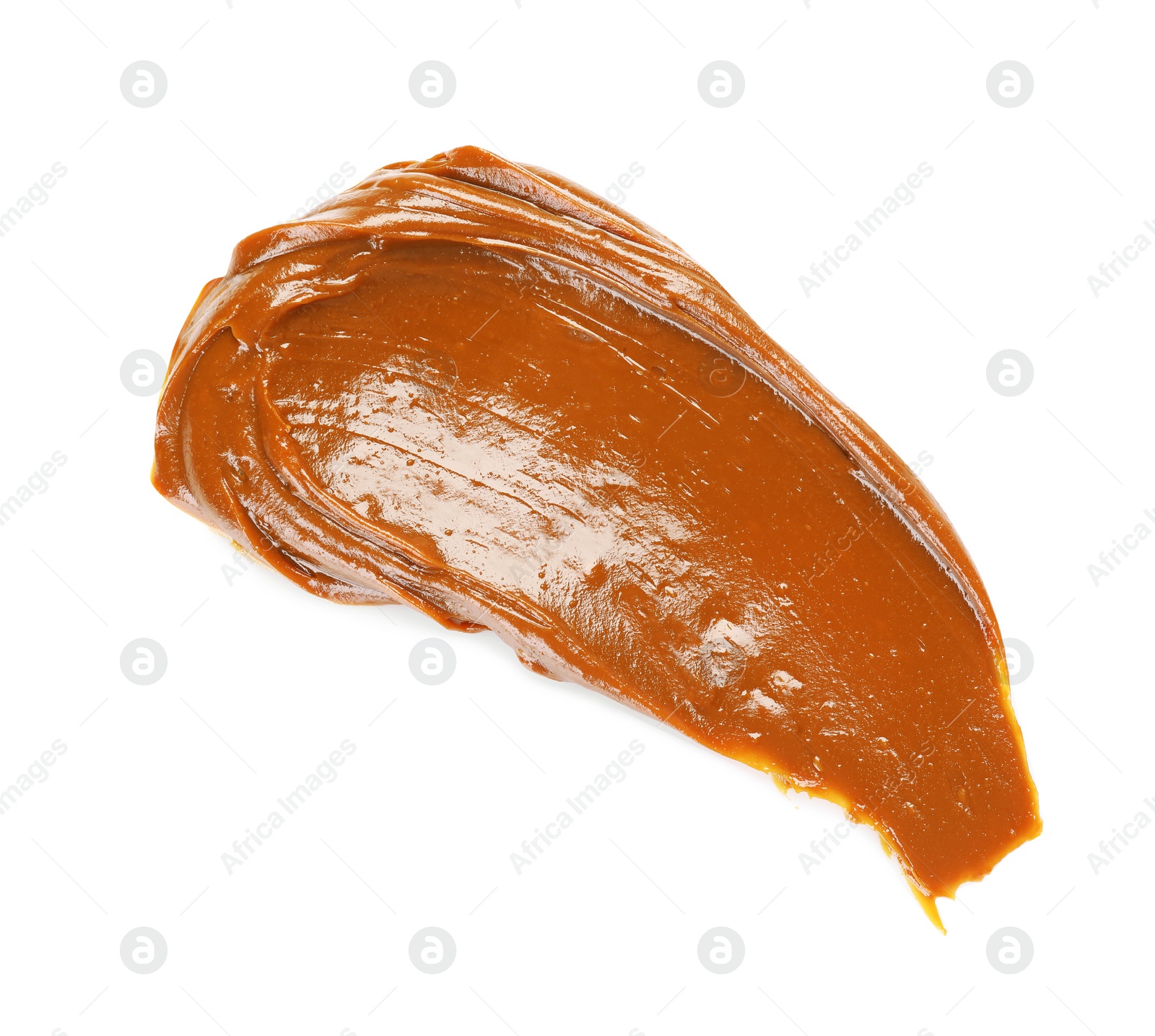 Photo of Smear of boiled condensed milk isolated on white, top view