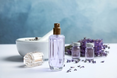 Composition with lavender flowers and natural cosmetic on table