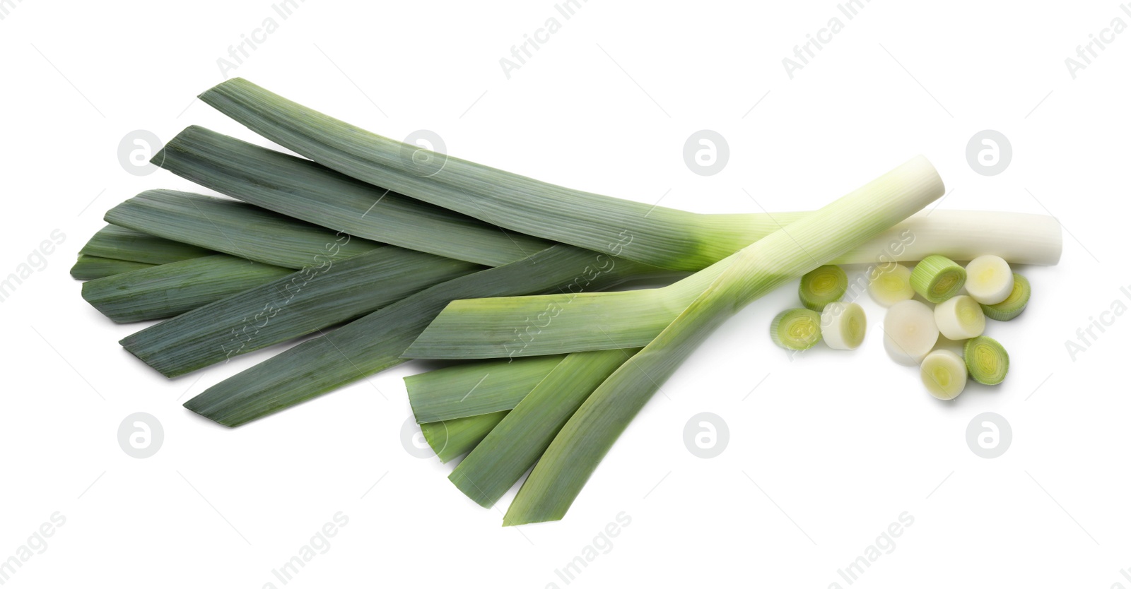 Photo of Whole and cut fresh leeks on white background, top view