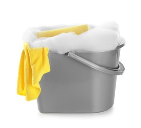 Photo of Plastic bucket with foam and sponge on white background. Cleaning supplies