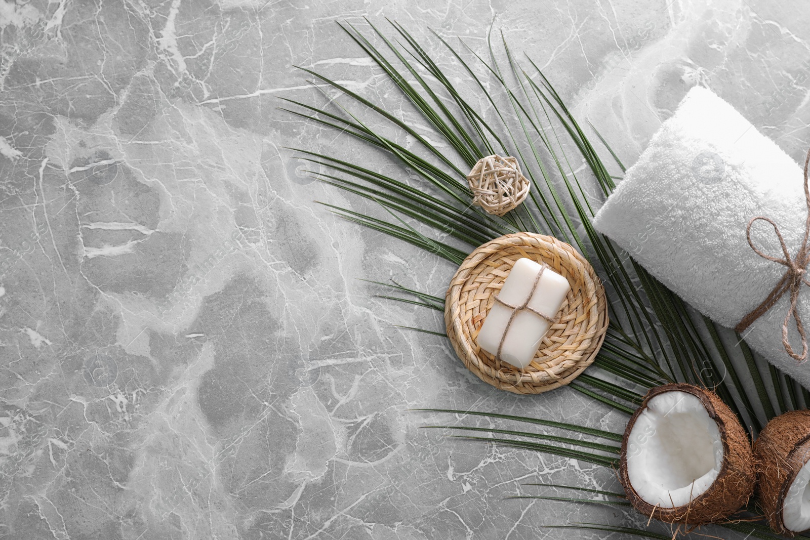 Photo of Flat lay composition with soap on grey marble background. Space for text