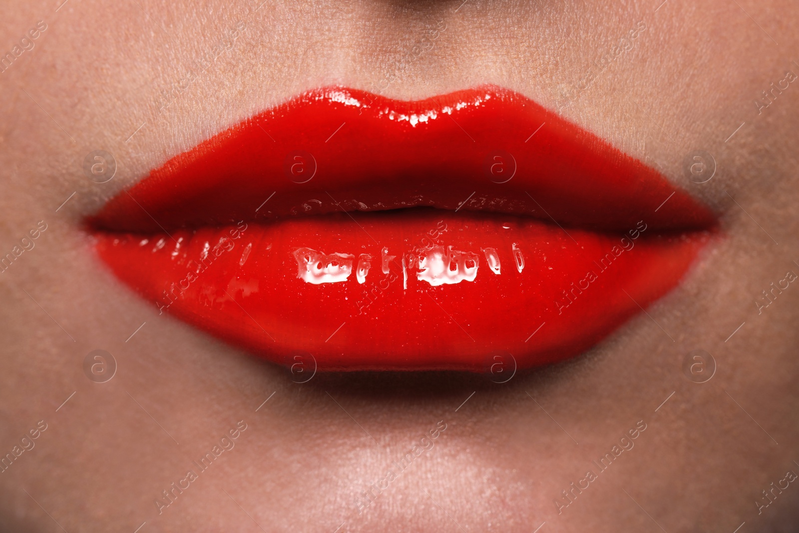 Photo of Young woman with beautiful red lips, closeup