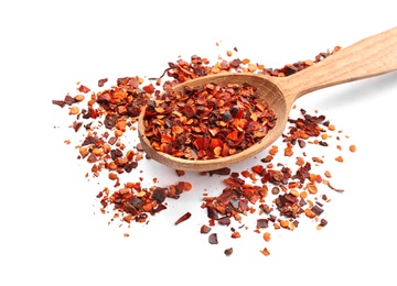 Photo of Wooden spoon and chili pepper flakes on white background