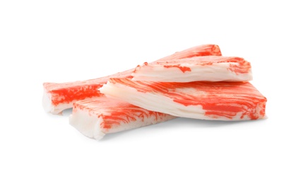 Cut and whole crab sticks isolated on white