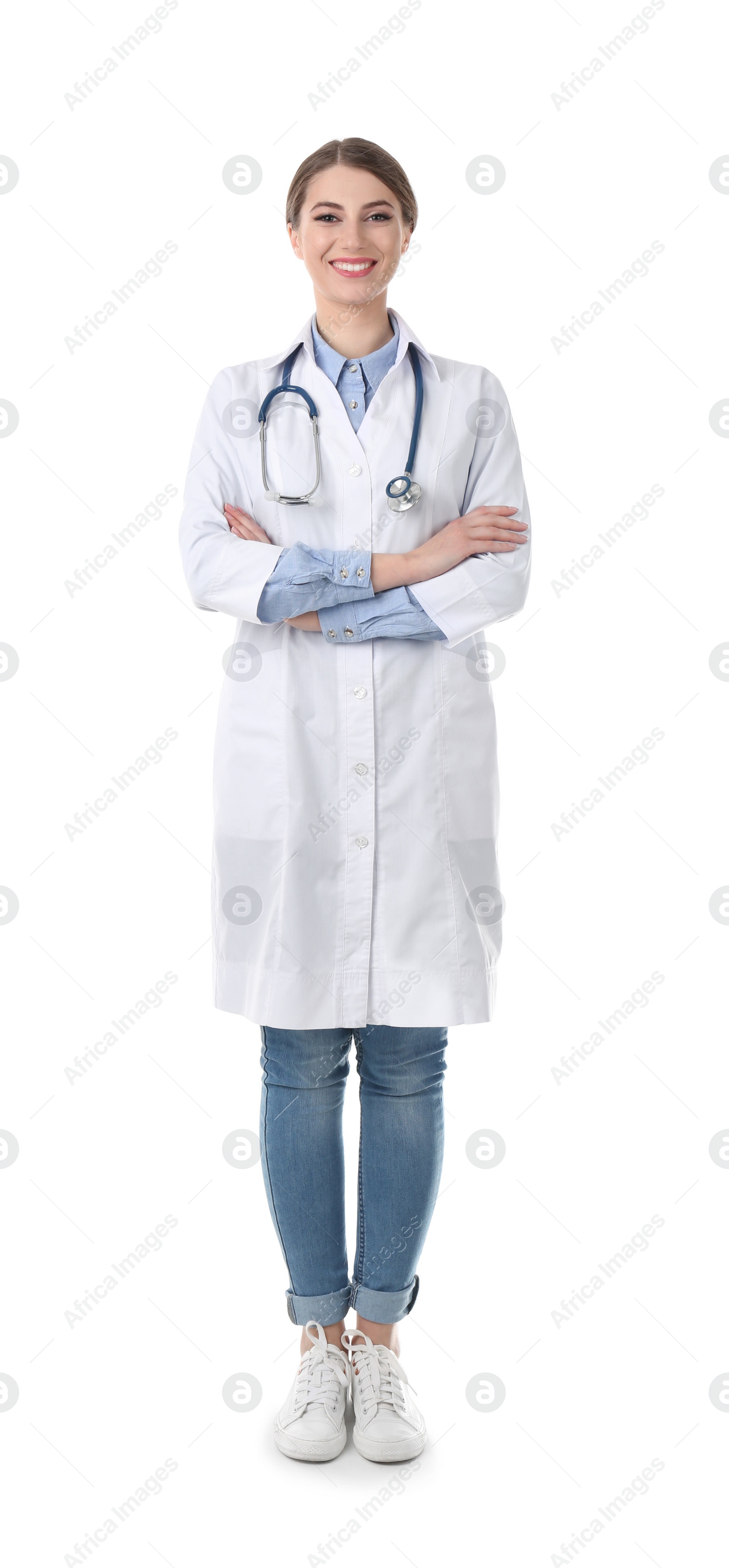 Photo of Young medical student in uniform on white background