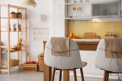 Modern kitchen interior with stylish wooden table