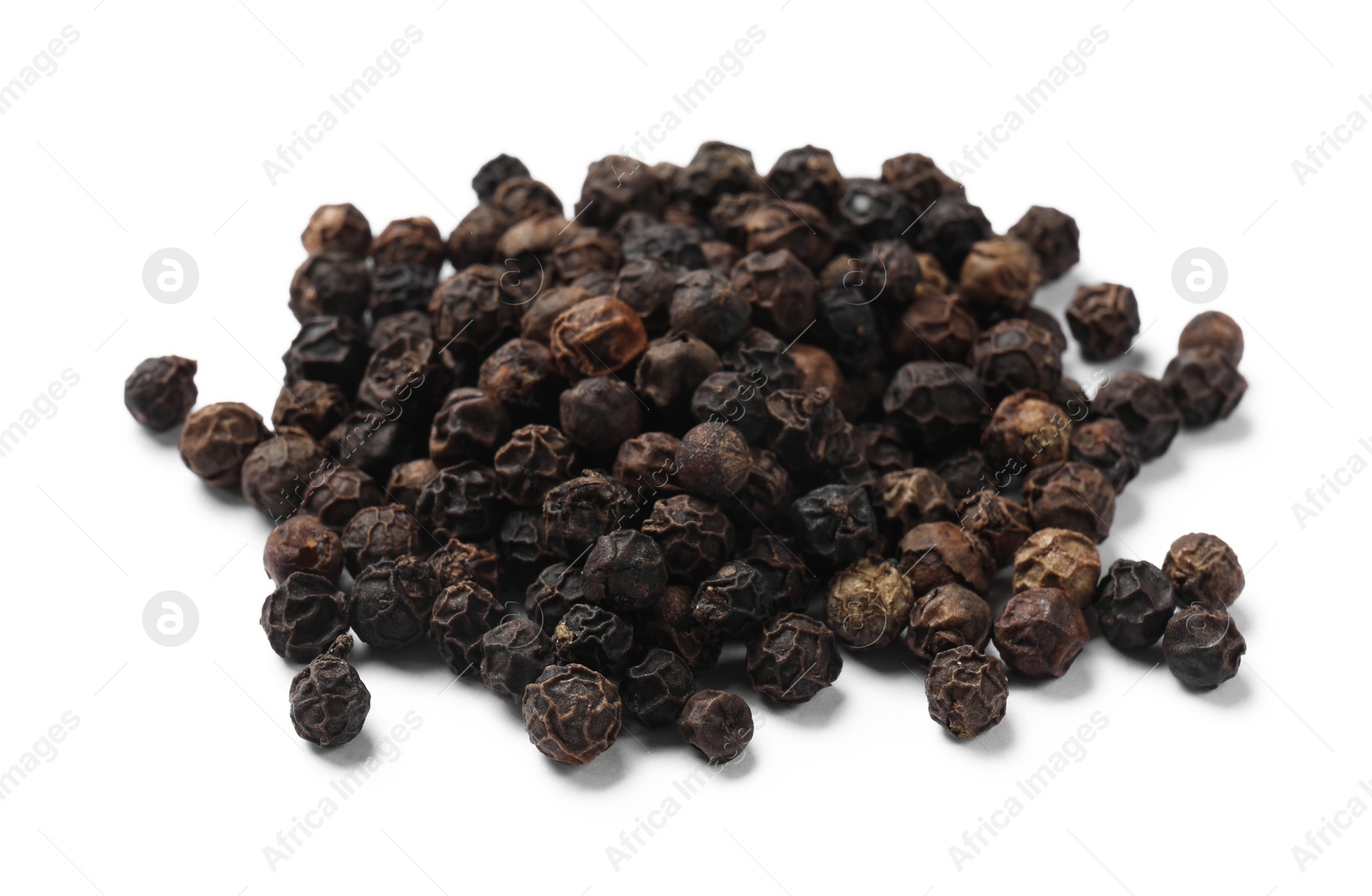 Photo of Aromatic spice. Many black dry peppercorns isolated on white