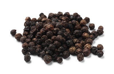 Aromatic spice. Many black dry peppercorns isolated on white