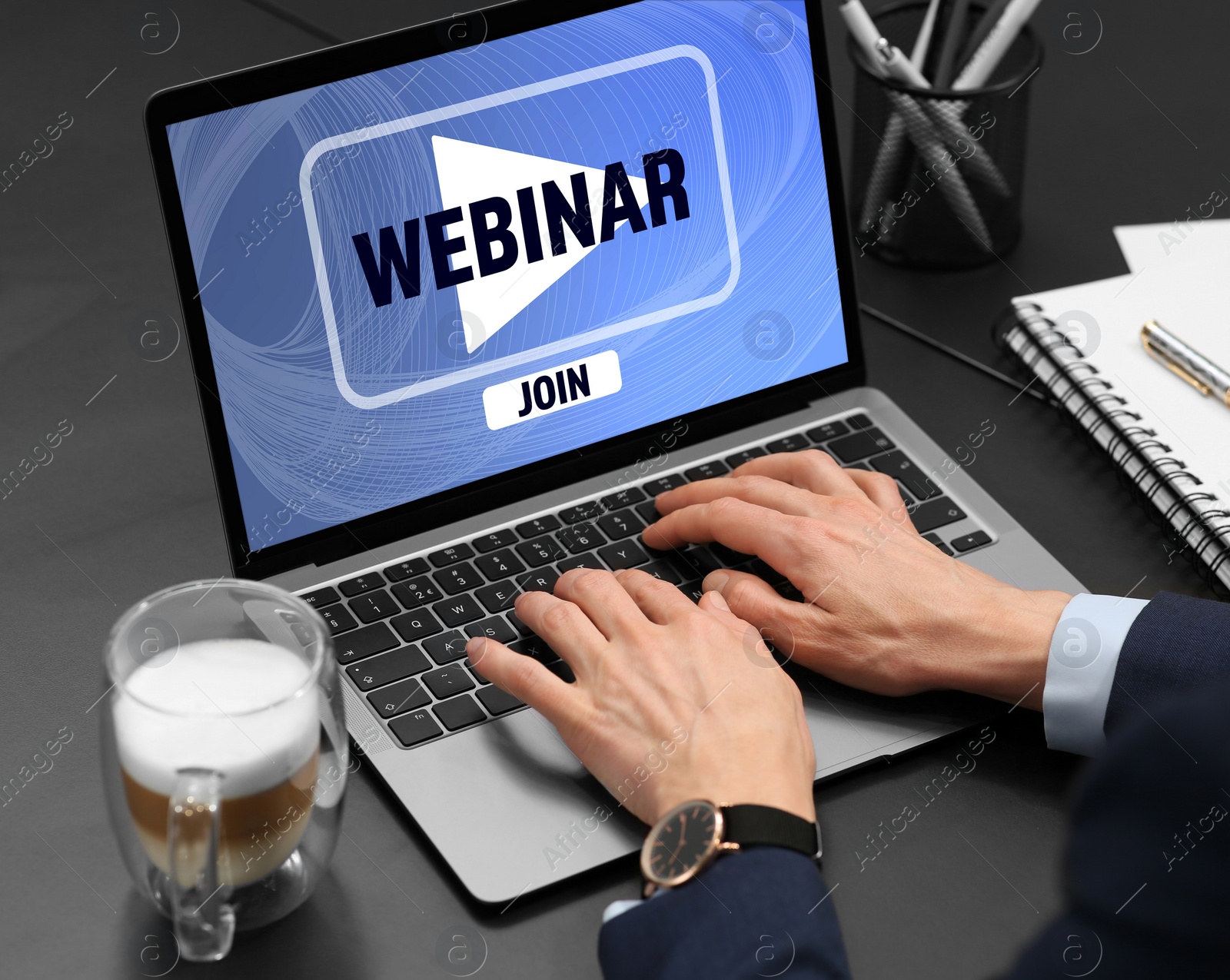 Image of Online webinar, web page on computer screen. Woman using laptop at black table, closeup