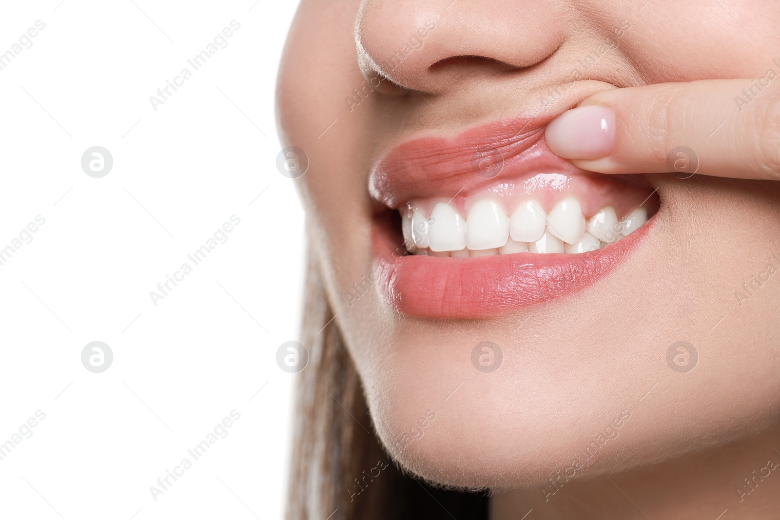 Photo of Woman showing healthy gums on white background, closeup. Space for text