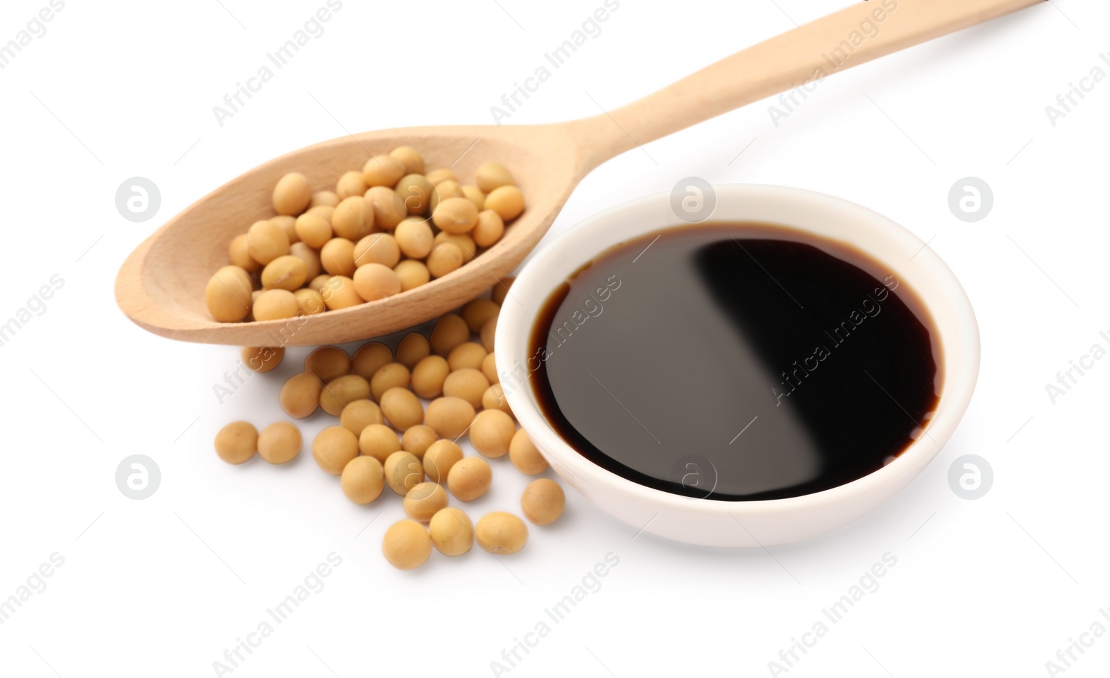 Photo of Bowl of soy sauce and soybeans isolated on white