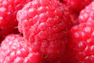 Many fresh ripe raspberries as background, closeup
