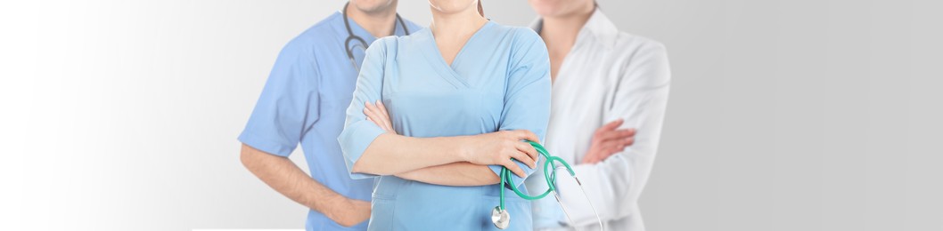Image of Doctors and nurse on white background, closeup. Banner design