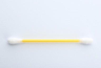 Photo of Plastic cotton swab on white background, top view
