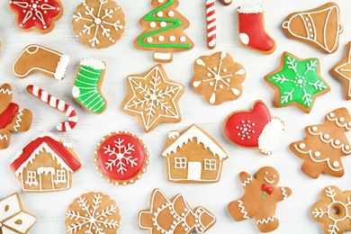 Photo of Tasty homemade Christmas cookies on wooden background, top view