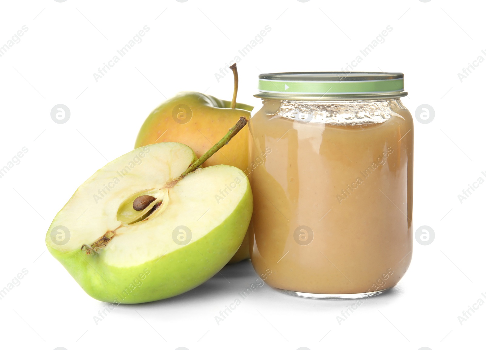 Photo of Jar with healthy baby food and apples on white background