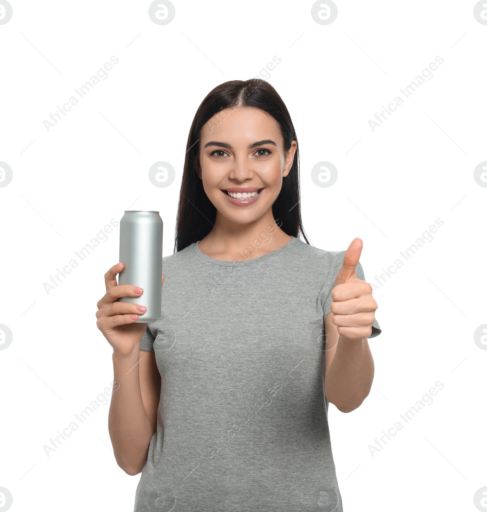 Photo of Beautiful happy woman holding beverage can and showing thumbs up on white background