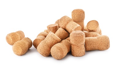 Heap of sparkling wine corks on white background