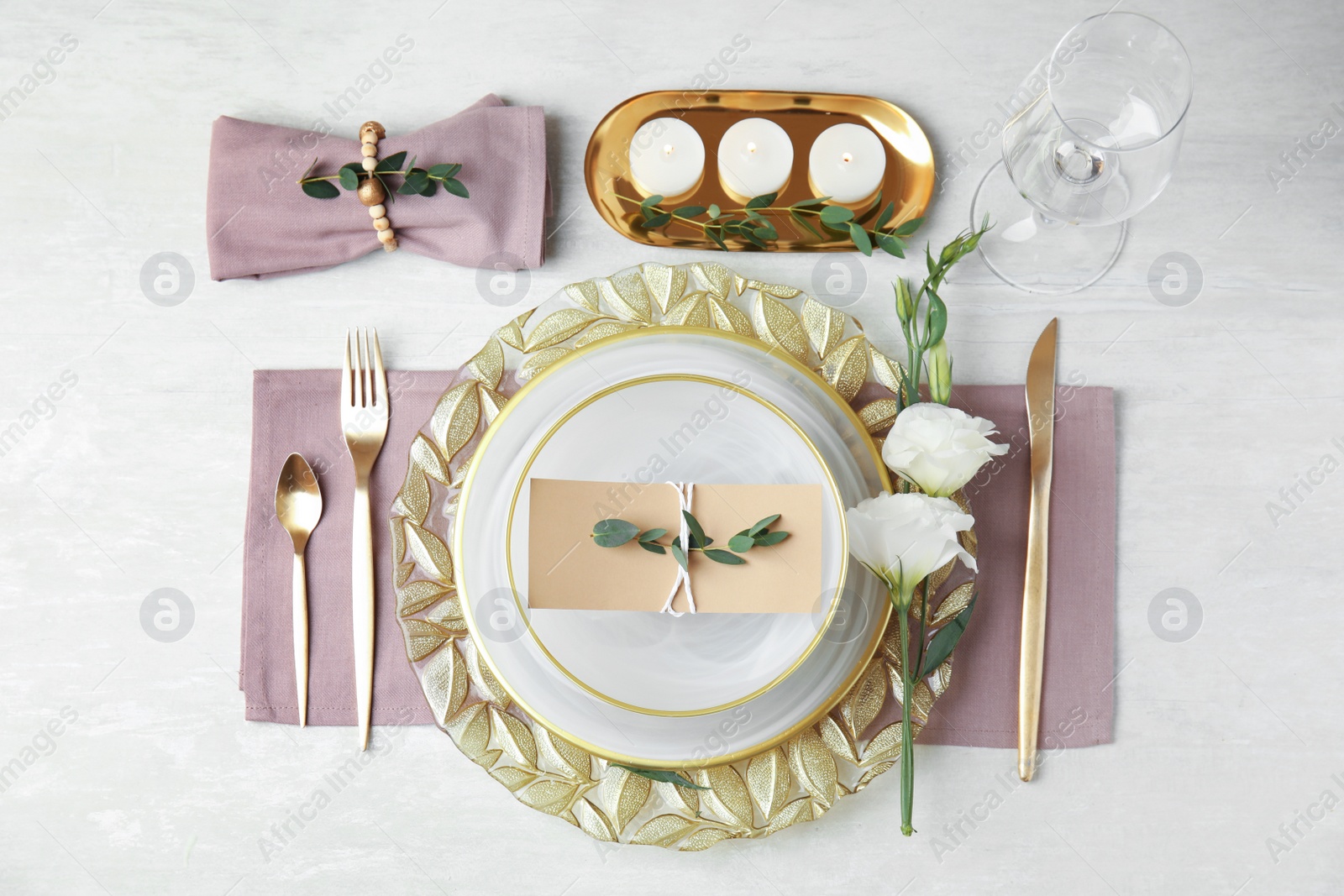 Photo of Elegant festive table setting on light background, flat lay