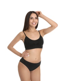 Photo of Portrait of attractive young woman with slim body in underwear on white background