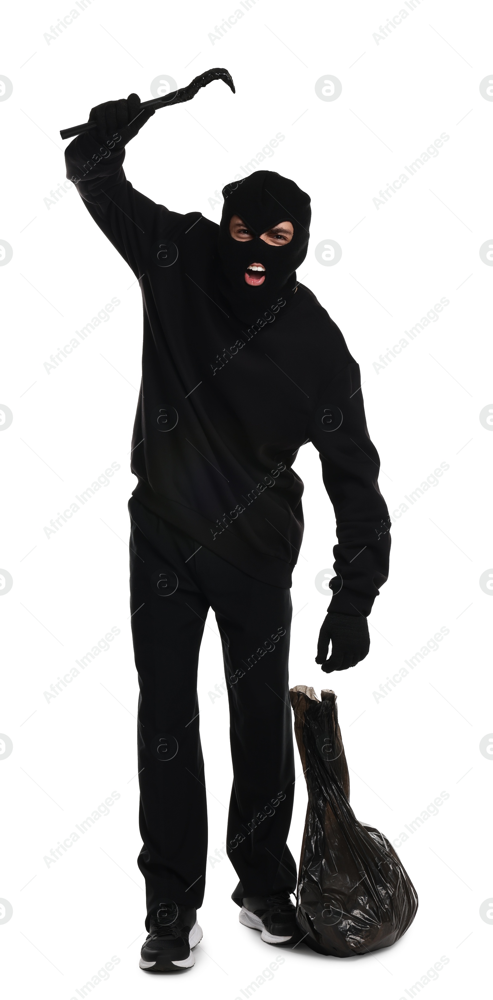 Photo of Angry thief in balaclava raising hand with crowbar on white background
