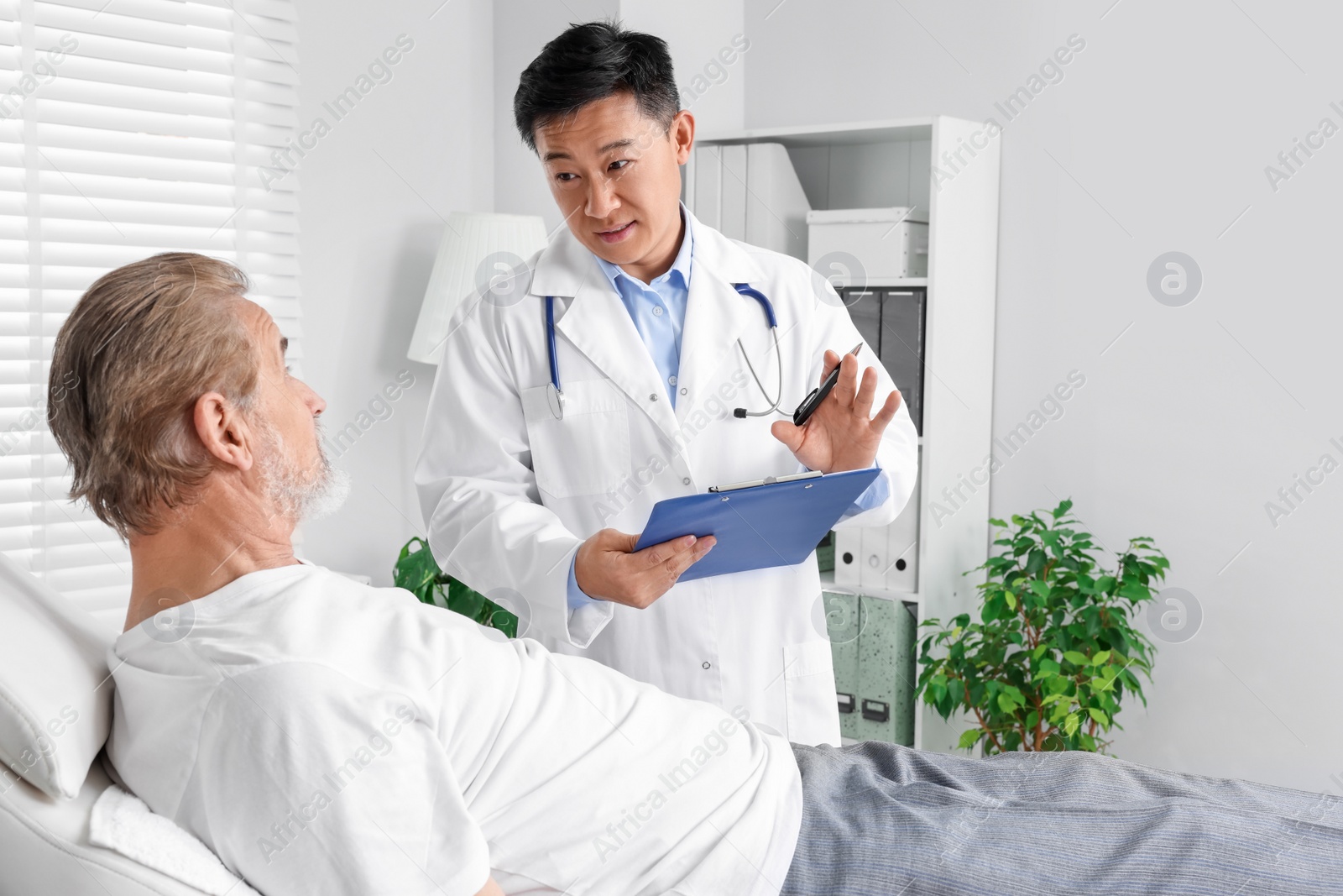 Photo of Senior patient having appointment with doctor in clinic