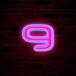 Image of Glowing neon number 9 sign on brick wall