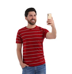 Photo of Smiling man taking selfie with smartphone on white background