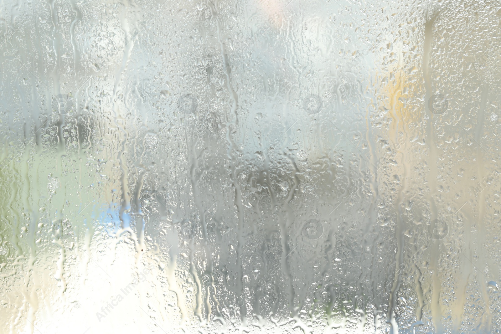 Photo of Window glass with raindrops as background, closeup