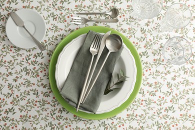 Photo of Stylish setting with cutlery, plates, napkin and glasses on table, flat lay