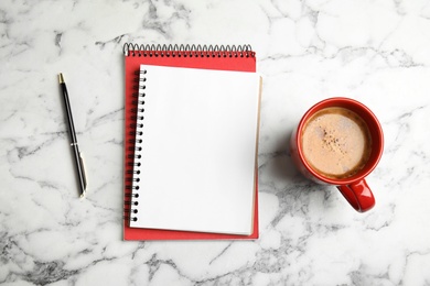 Photo of Flat lay composition with notebooks and coffee on marble background