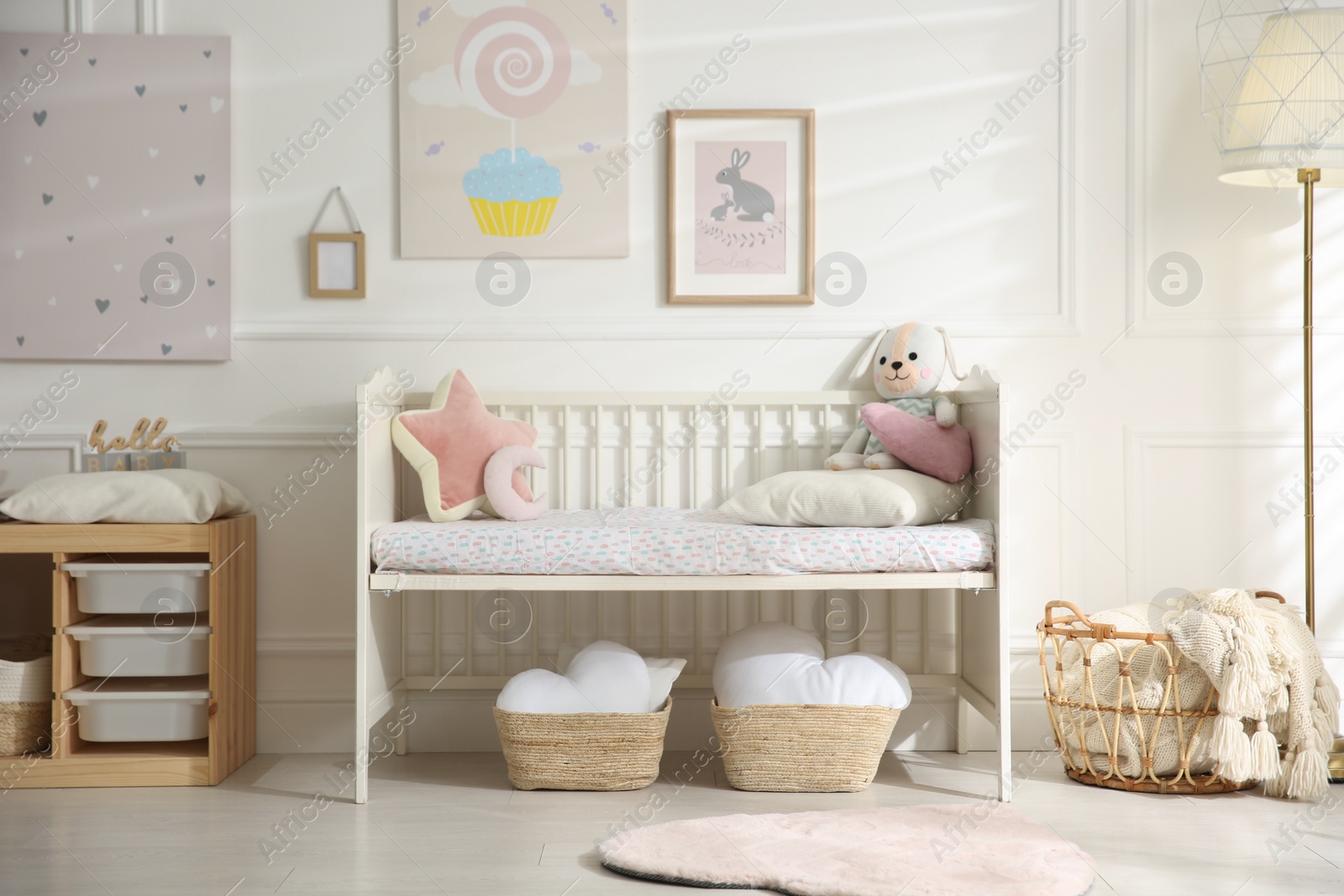 Photo of Baby room interior with stylish furniture and toys