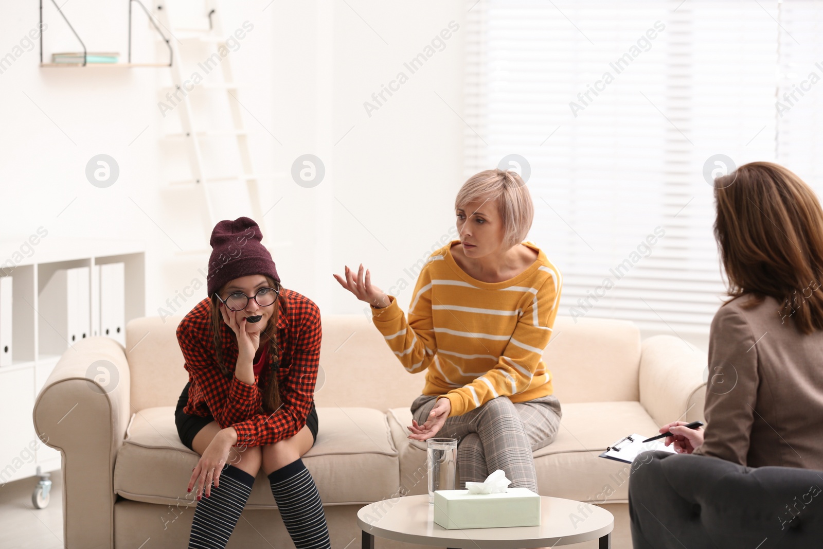 Photo of Woman complaining about difficult daughter in psychotherapist office