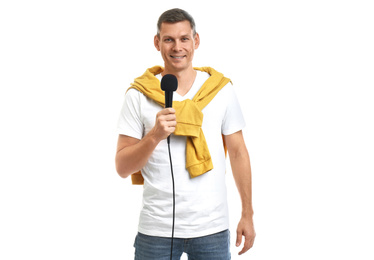 Male journalist with microphone on white background