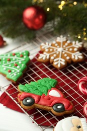 Photo of Tasty homemade Christmas cookies and decor on white table