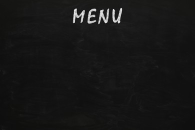 Image of Black chalkboard with word Menu as background. Mockup for design