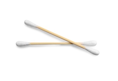 Photo of Wooden cotton buds on white background, top view