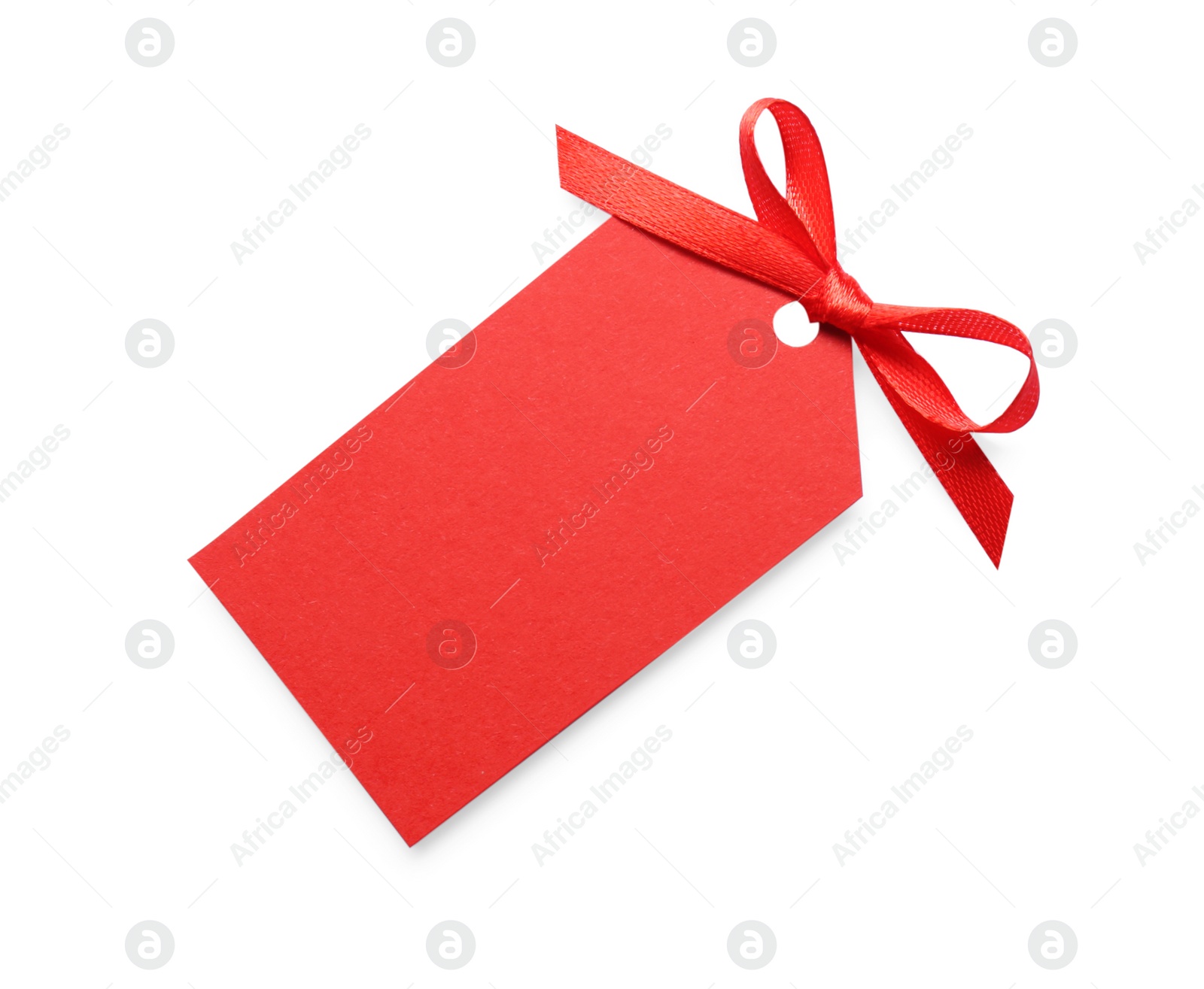 Photo of Blank red gift tag with satin ribbon on white background, top view