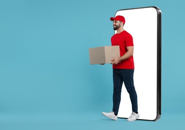 Courier with parcel walking out from huge smartphone on light blue background. Delivery service. Space for text
