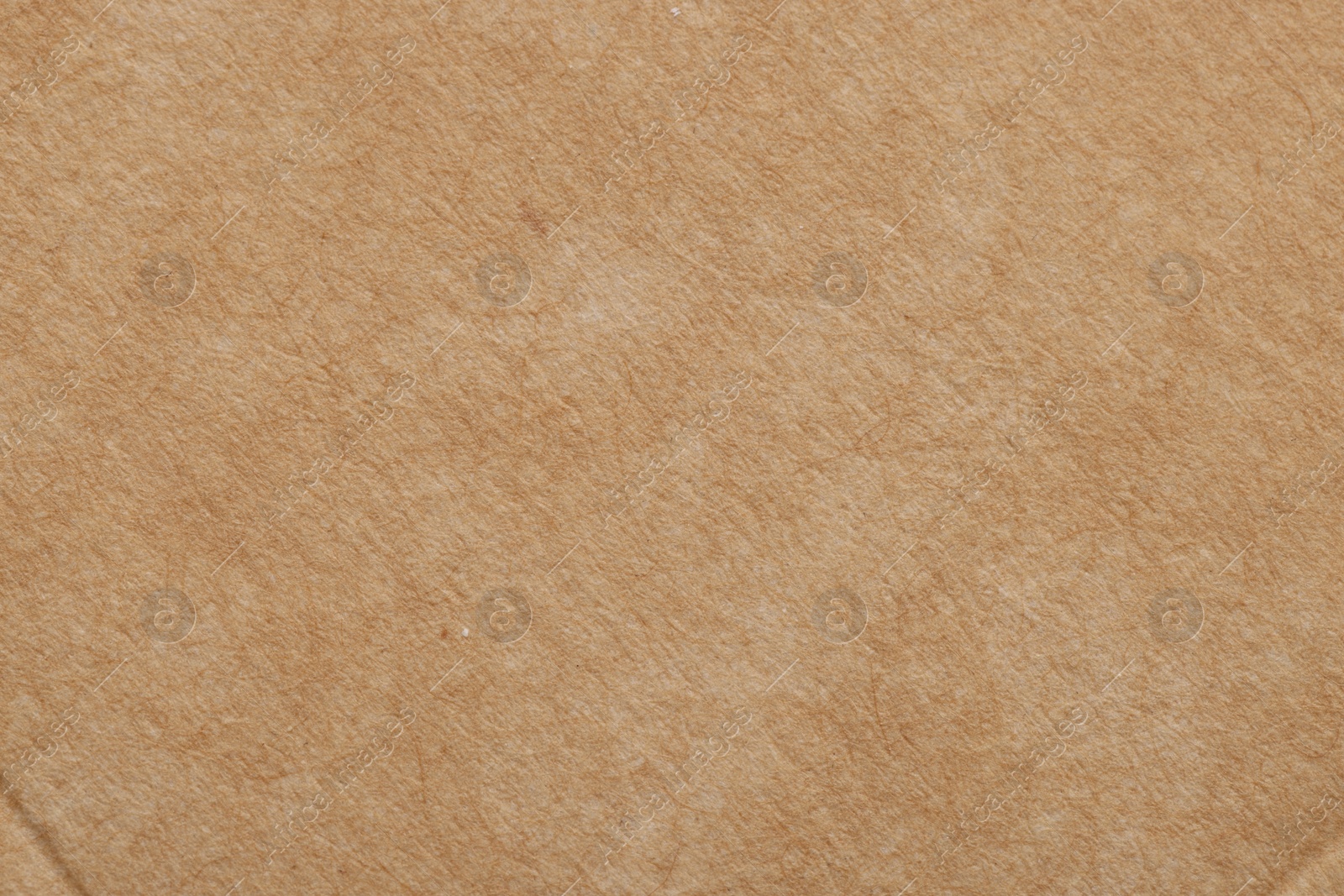 Photo of Texture of beige paper sheet as background, top view