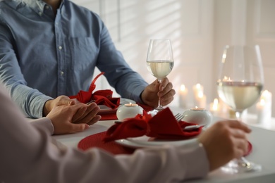 Photo of Couple having romantic dinner at home, closeup