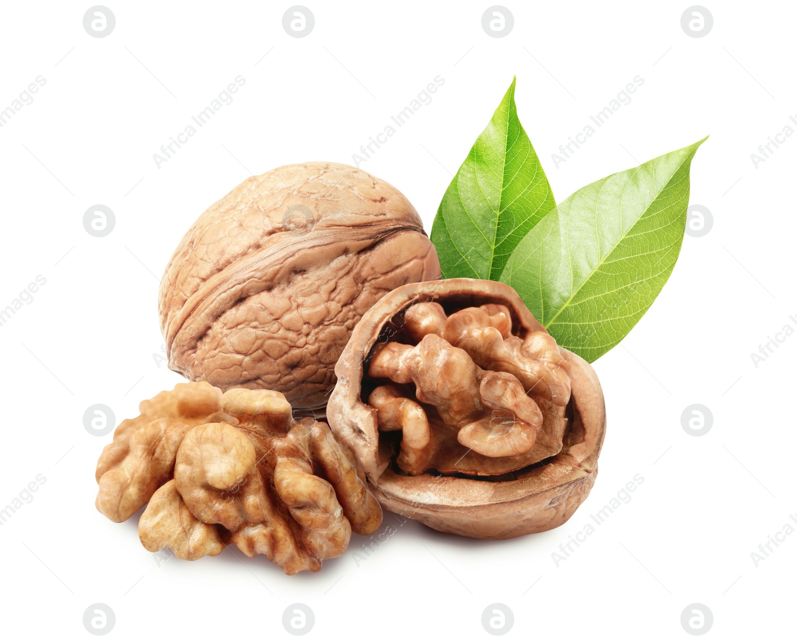 Image of Tasty walnuts and green leaves on white background