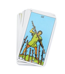Photo of Seven of Wands and other tarot cards on white background, top view