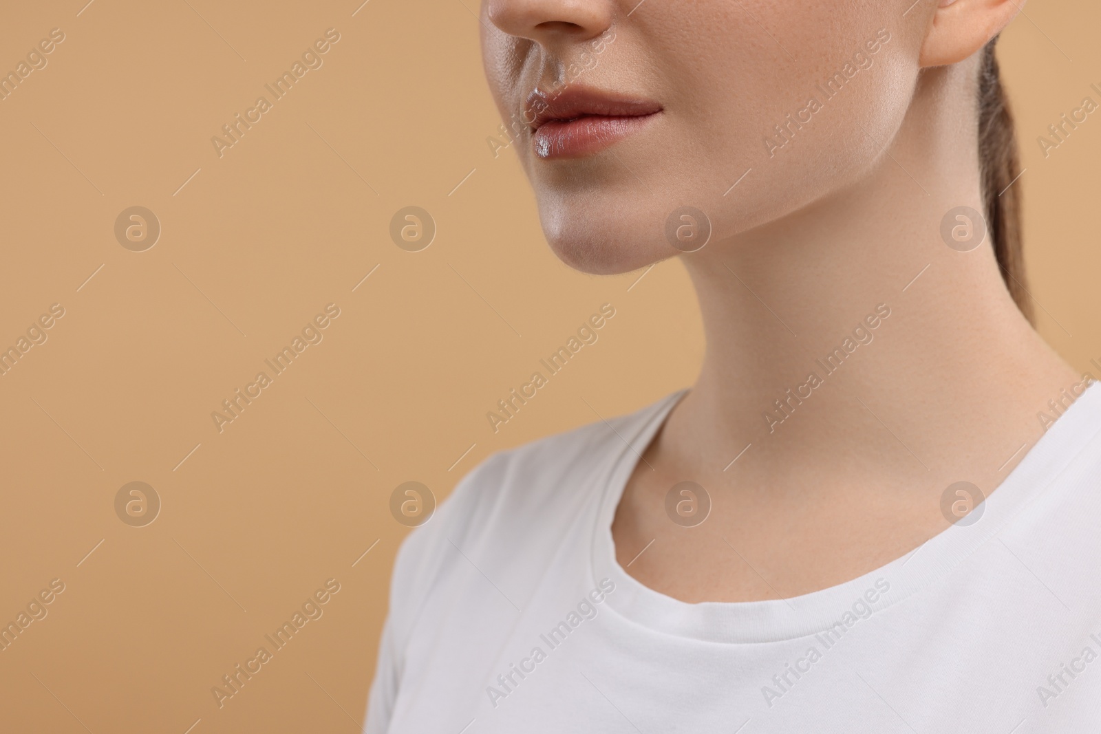 Photo of Beauty concept. Woman on beige background, closeup. Space for text