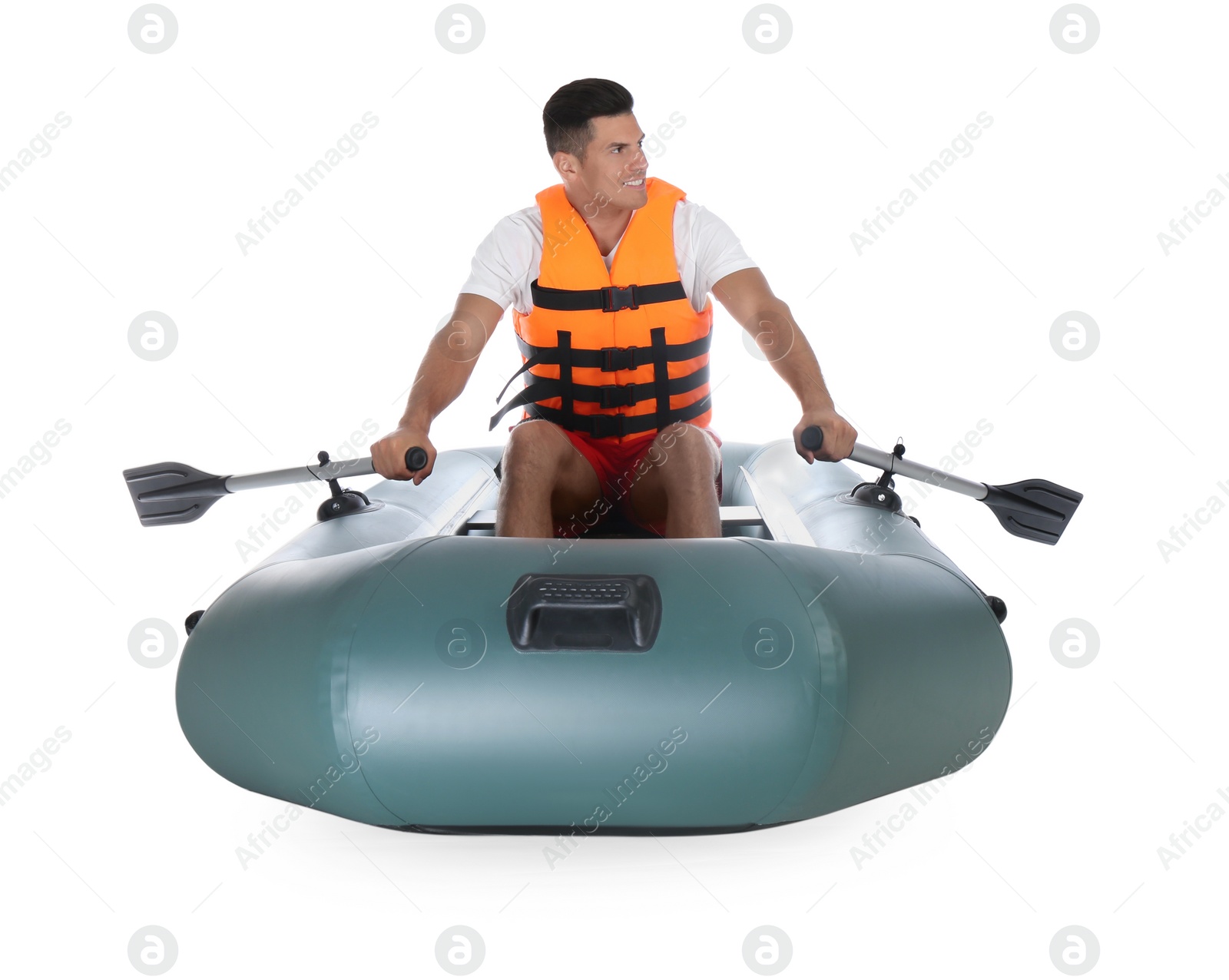 Photo of Man in life vest rowing inflatable rubber boat on white background