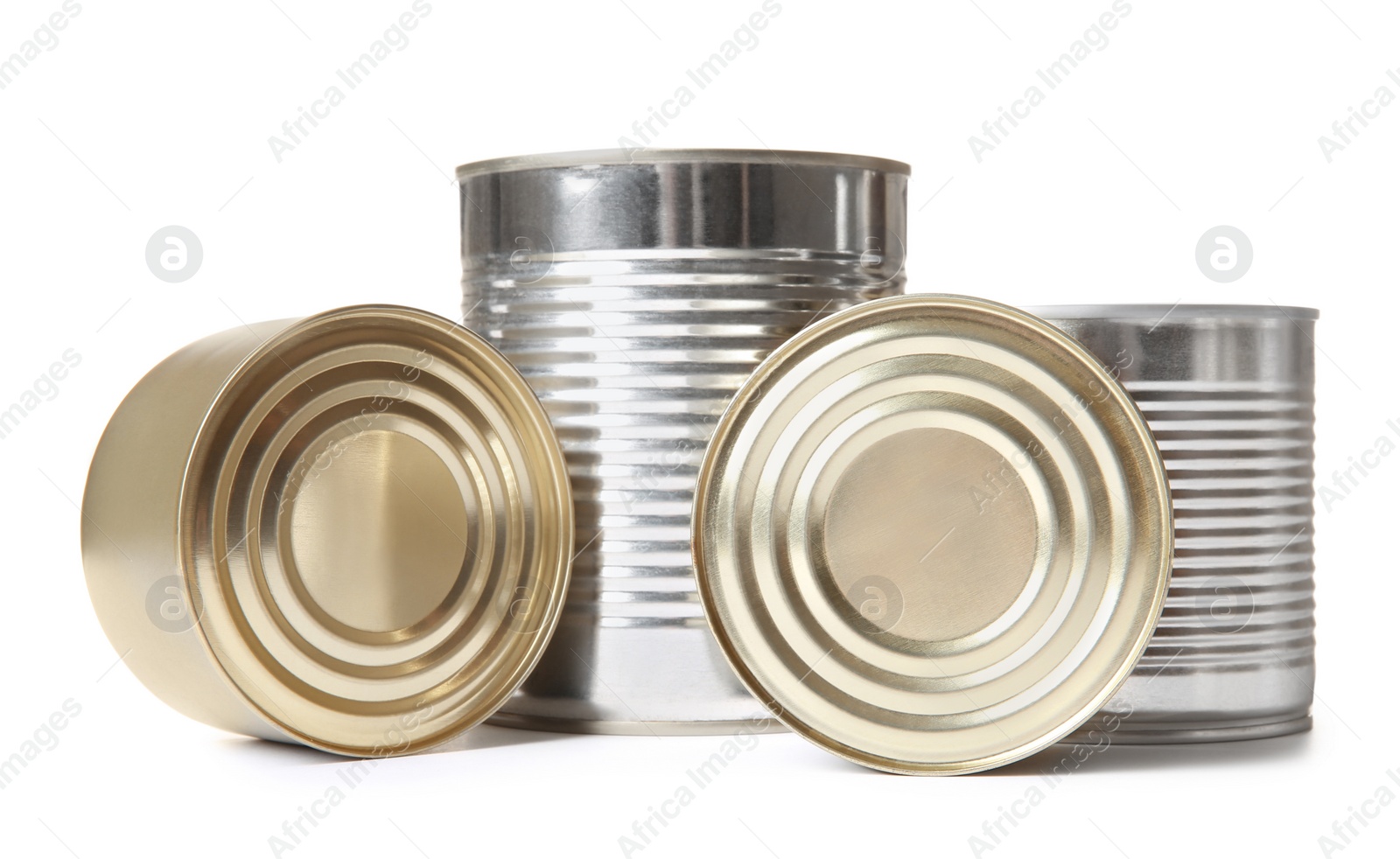 Photo of Closed tin cans isolated on white, mockup for design